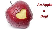 "An Apple a Day Keeps the Doctor Away: Exploring the Health Benefits of This Timeless Adage". Picture of an apple with a heart shape cut out of it.