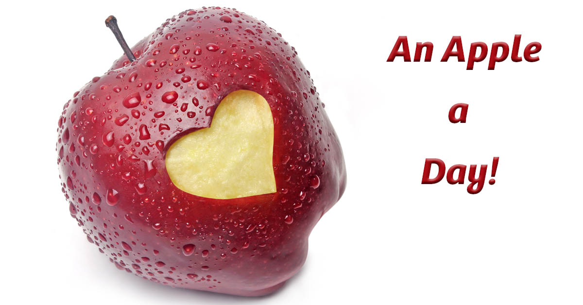 "An Apple a Day Keeps the Doctor Away: Exploring the Health Benefits of This Timeless Adage". Picture of an apple with a heart shape cut out of it.
