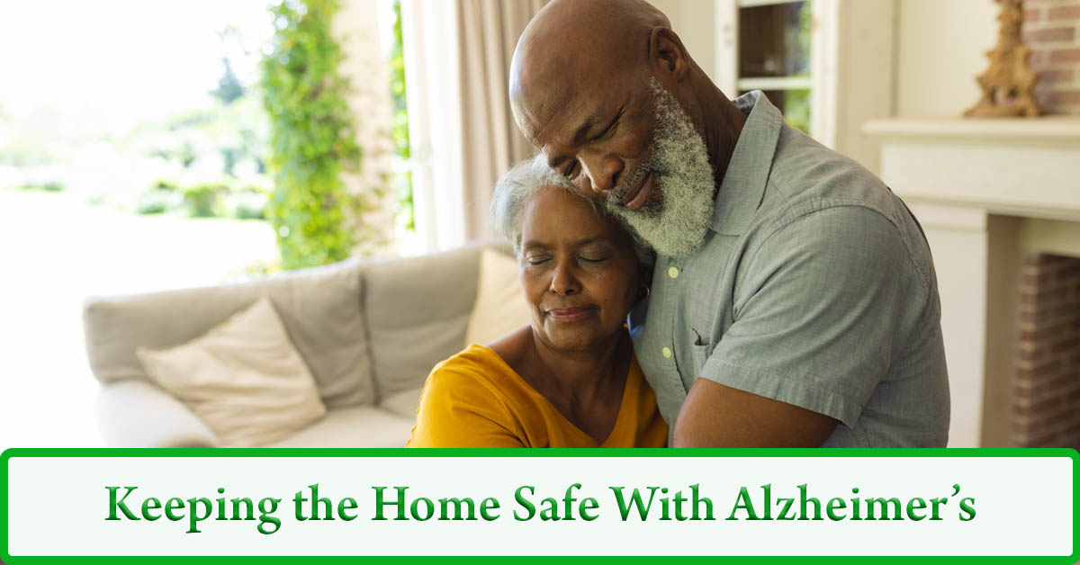 Making a Home Safe for Alzheimer’s Patients. Picture of a black male and female embraced in a hug in their living room.