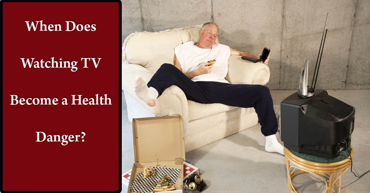 How Much Is Too Much When Watching TV? Picture of a middle aged caucasian male sitting on the couch watching TV and eating pizza.